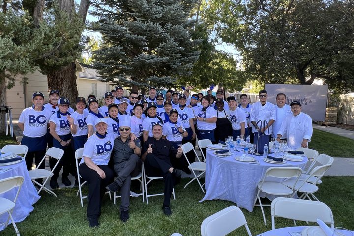 A group of people and chefs at an outdoor gathering, Trainee & Internship USA.